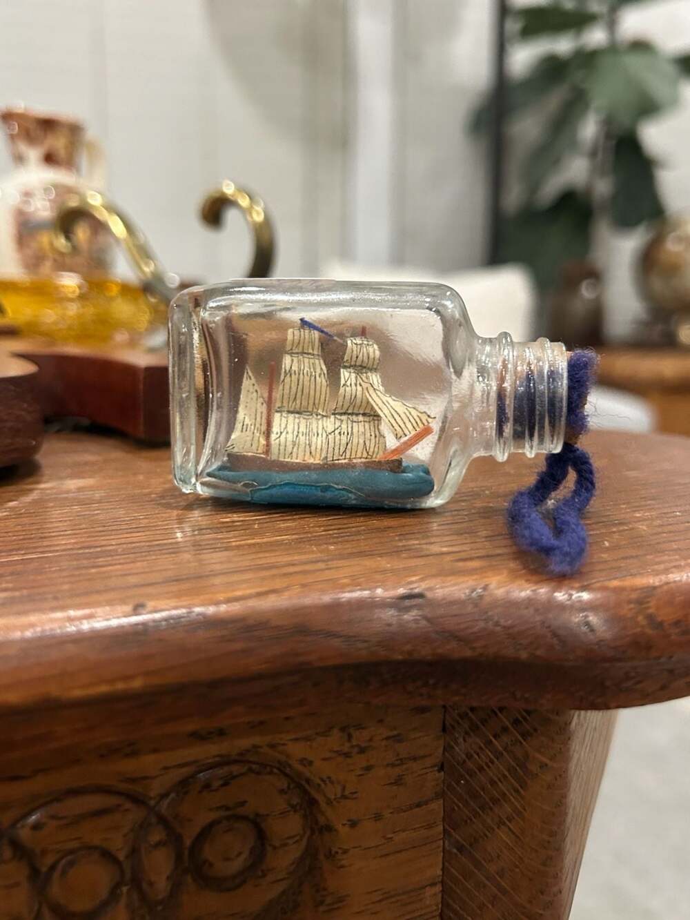 Vintage Miniature Tall Ship in a Glass Bottle with Cork and Blue Yarn